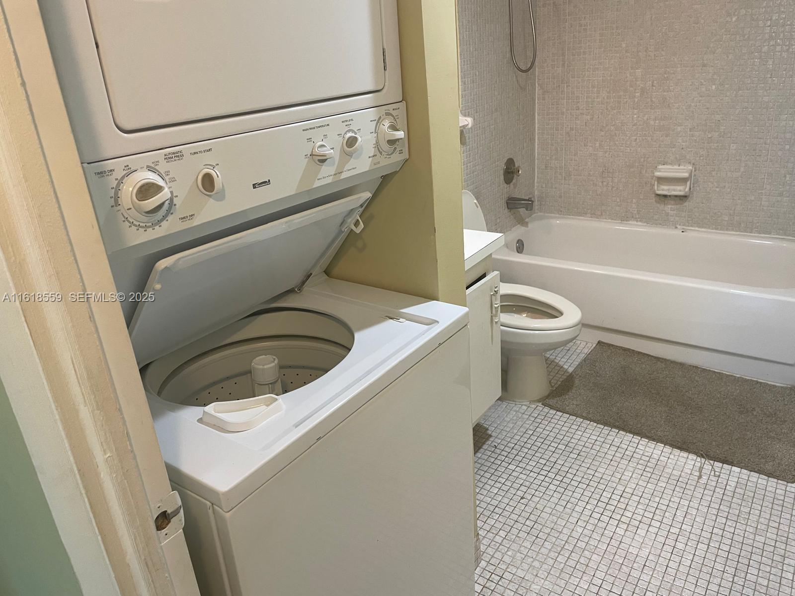 4168 Inverrary Drive, Unit 302 Lauderhill, FL 33319 - Photo 19 of 25 a utility room with dryer and washer