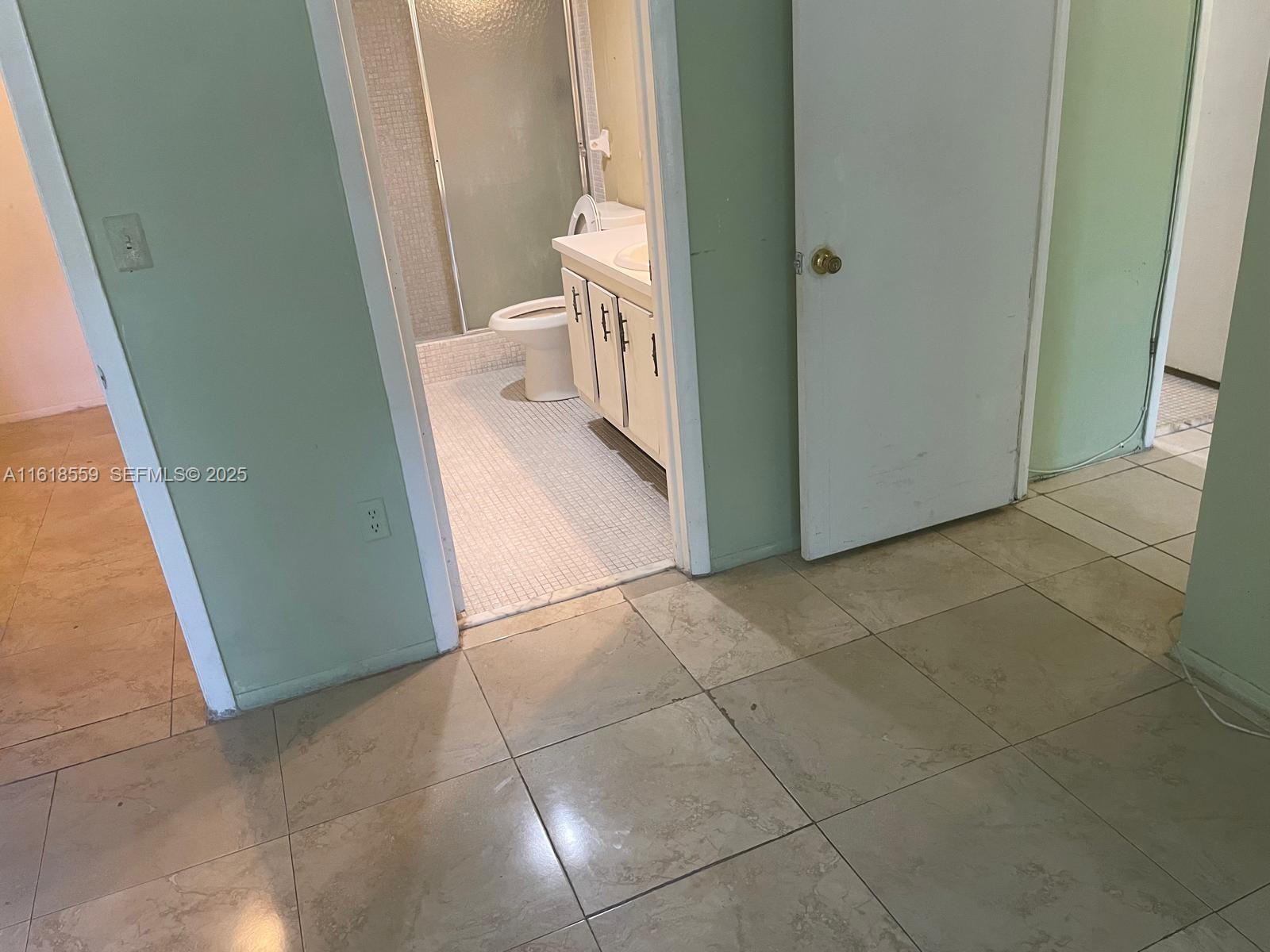 4168 Inverrary Drive, Unit 302 Lauderhill, FL 33319 - Photo 24 of 25 a view of a bathroom from a corridor