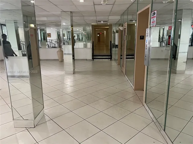 a view of a refrigerator and an entryway