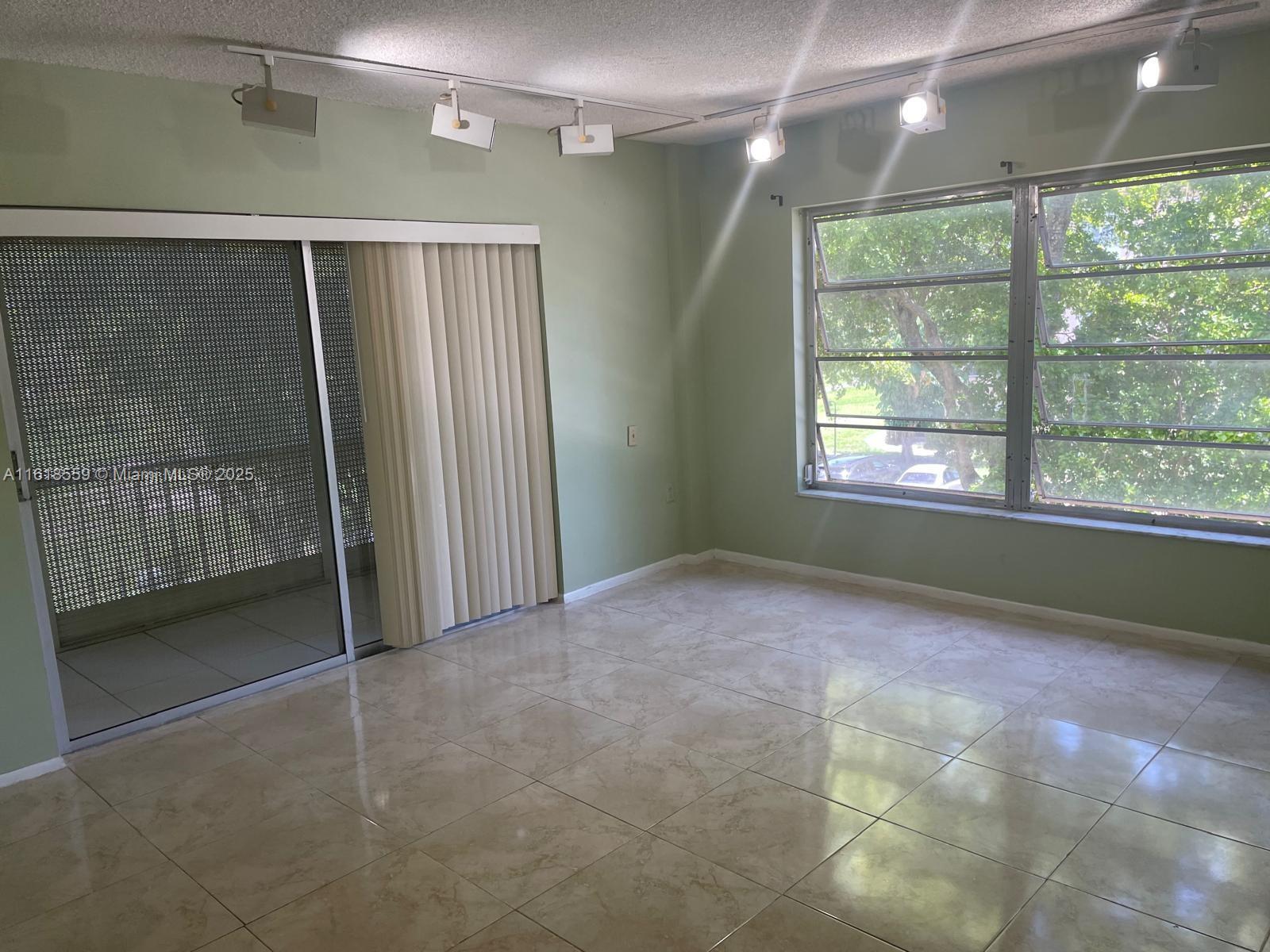 4168 Inverrary Drive, Unit 302 Lauderhill, FL 33319 - Photo 7 of 25 a view of an empty room with a window