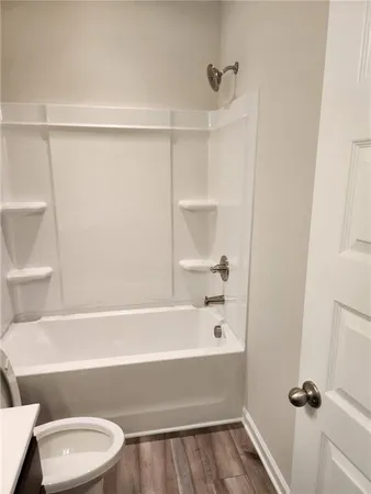 a bathroom with a sink a mirror and a light fixture