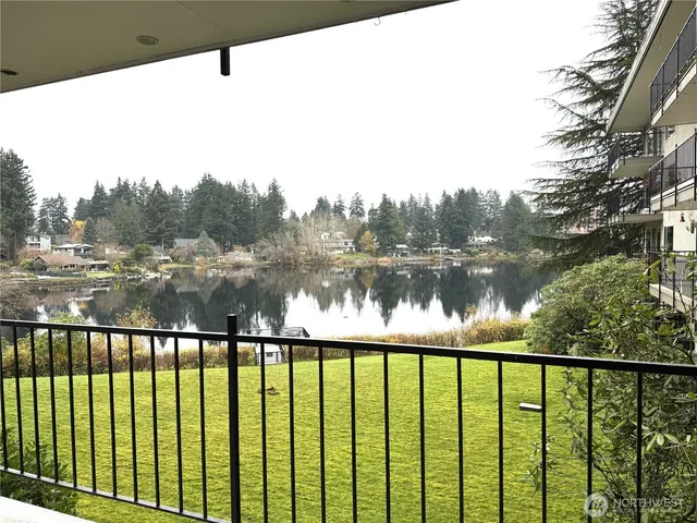 a front view of a building with tree s