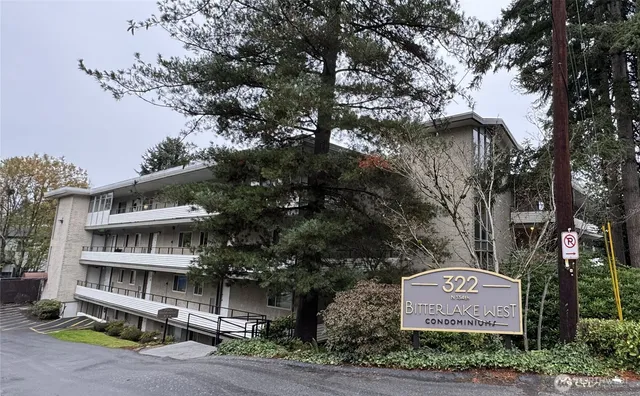 a couple of cars parked in front of a house