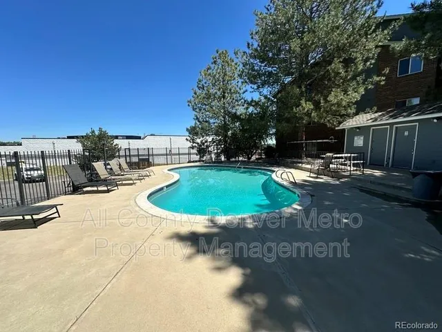 a view of a swimming pool with a patio
