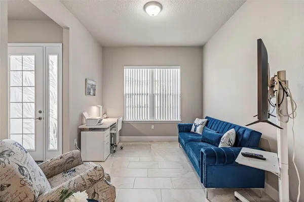 a bedroom with a bed and chair