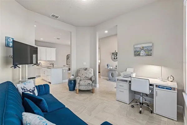 a bedroom with a bed and a couch
