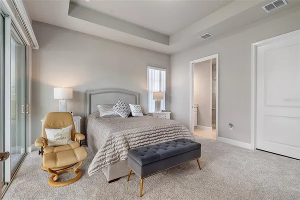 a bathroom with a granite countertop sink a toilet and a mirror