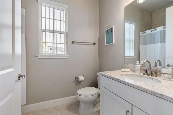 a view of a swimming pool with an outdoor seating and a garden