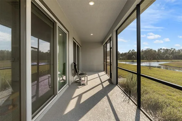 an aerial view of a house with a swimming pool