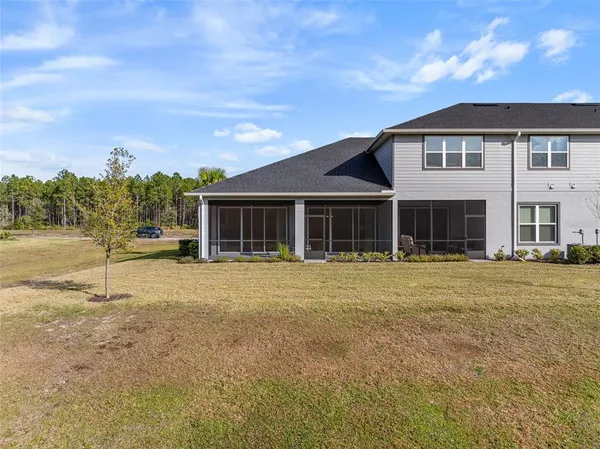 an aerial view of a house with a swimming pool