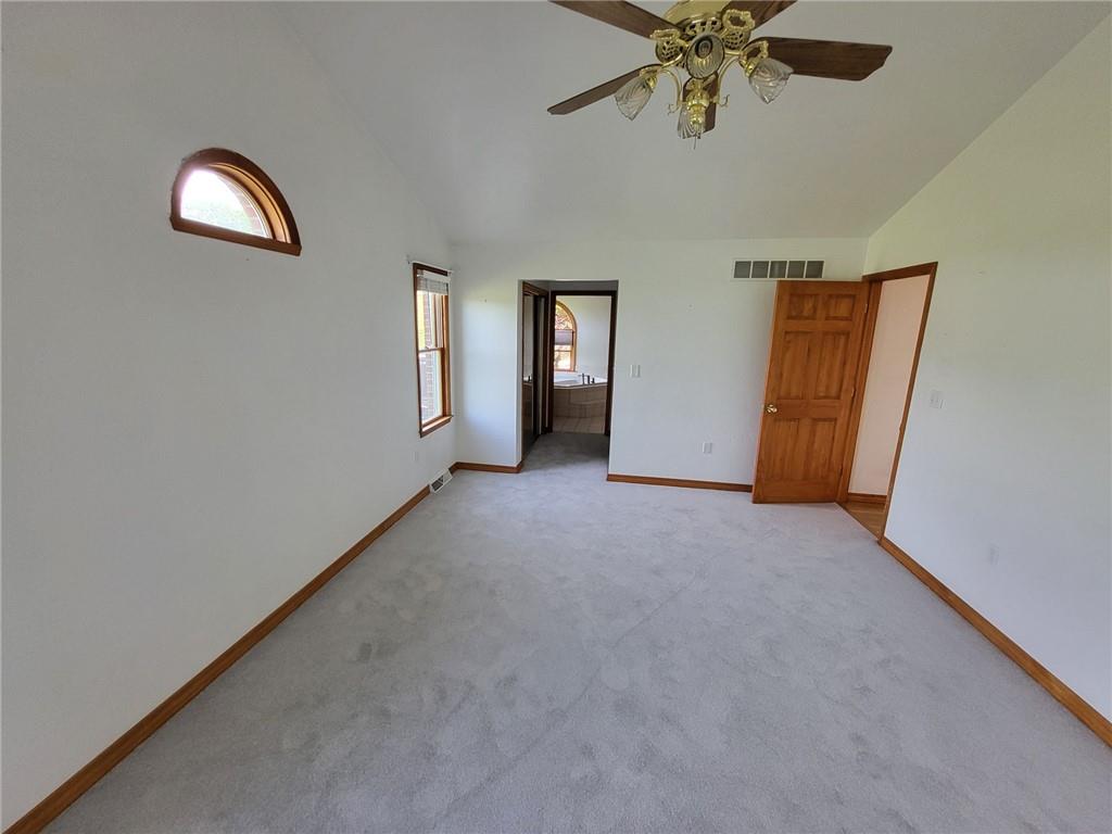 56 Lanik Road Bentleyville, PA 15314 - Photo 29 of 50 an empty room with chandelier fan and windows