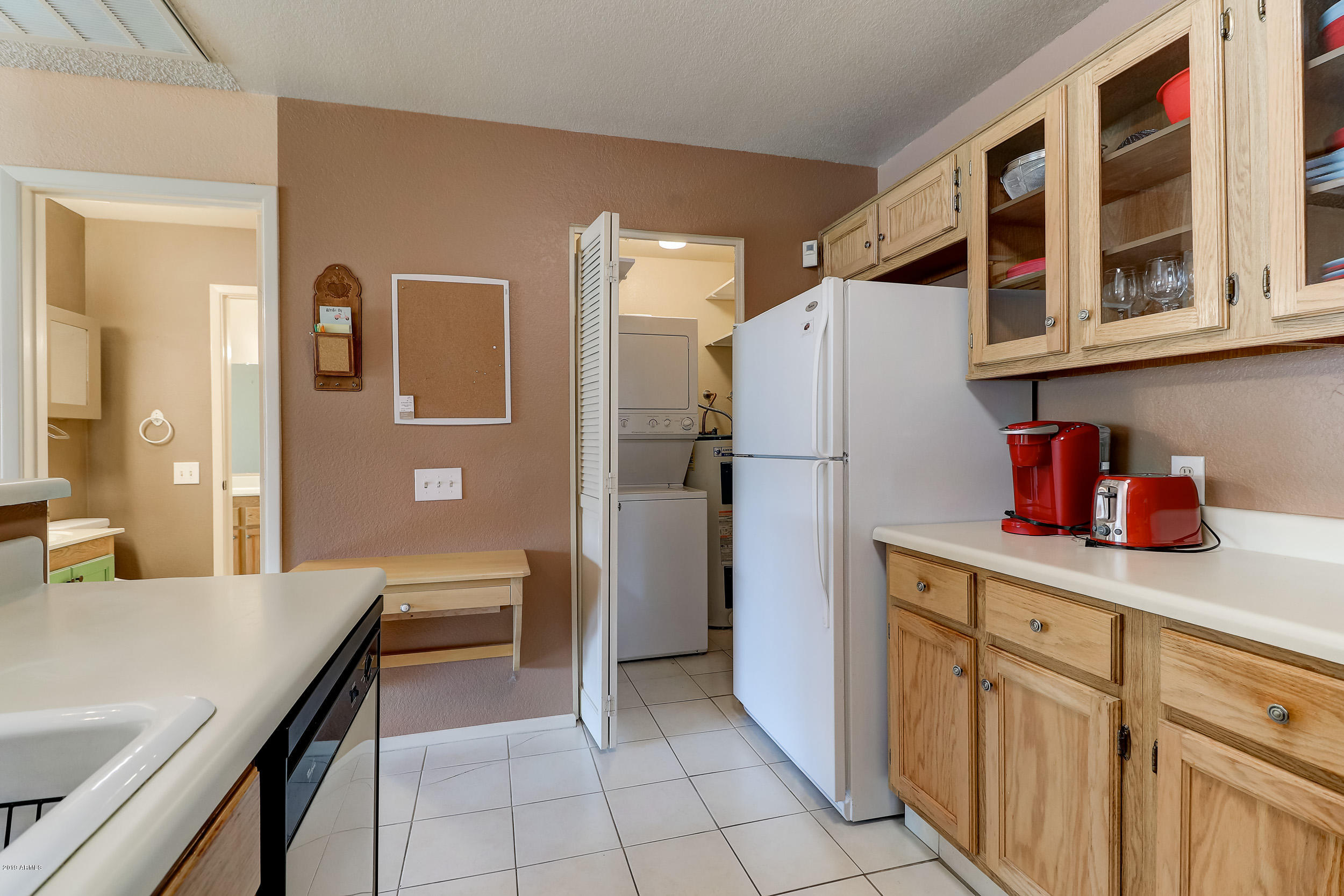 14300 West Bell Road, Unit 497 Surprise, AZ 85374 - Photo 10 of 43 Kitchen To Laundry Room View