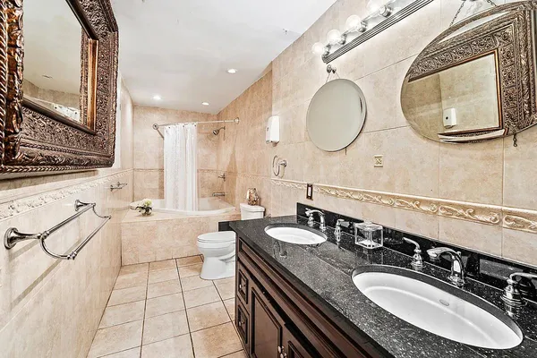a bathroom with a sink double vanity and a mirror