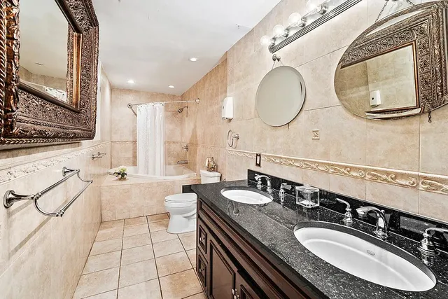a bathroom with a sink double vanity and a mirror