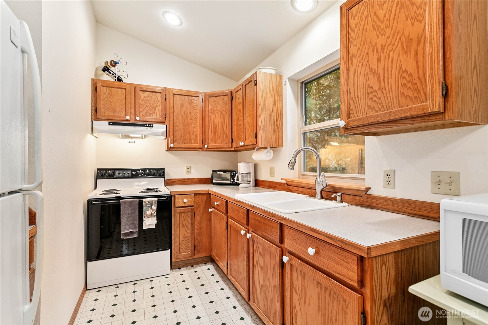 22014 Pinnacle Road Glacier, WA 98244 - Photo 11 of 31 a kitchen with a sink stove and cabinets