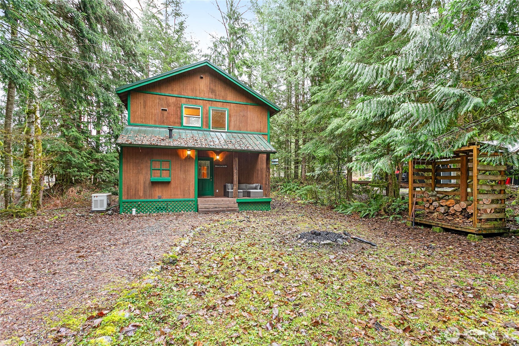 22014 Pinnacle Road Glacier, WA 98244 - Photo 28 of 31 a front view of a house with a garden