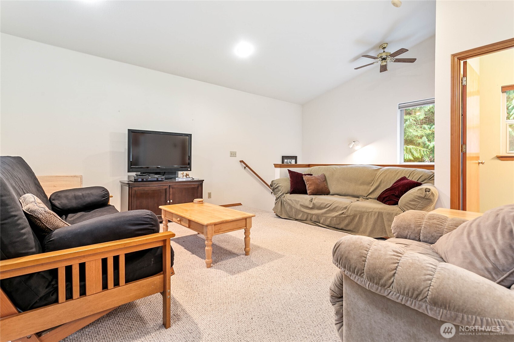 22014 Pinnacle Road Glacier, WA 98244 - Photo 4 of 31 a living room with furniture and a flat screen tv