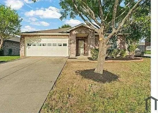 a front view of a building with garden