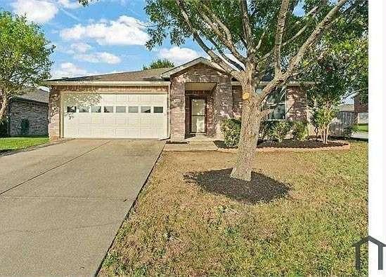 a front view of a building with garden