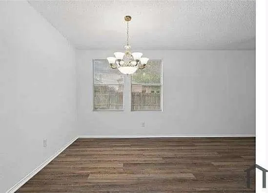 a view of a chandelier in big room
