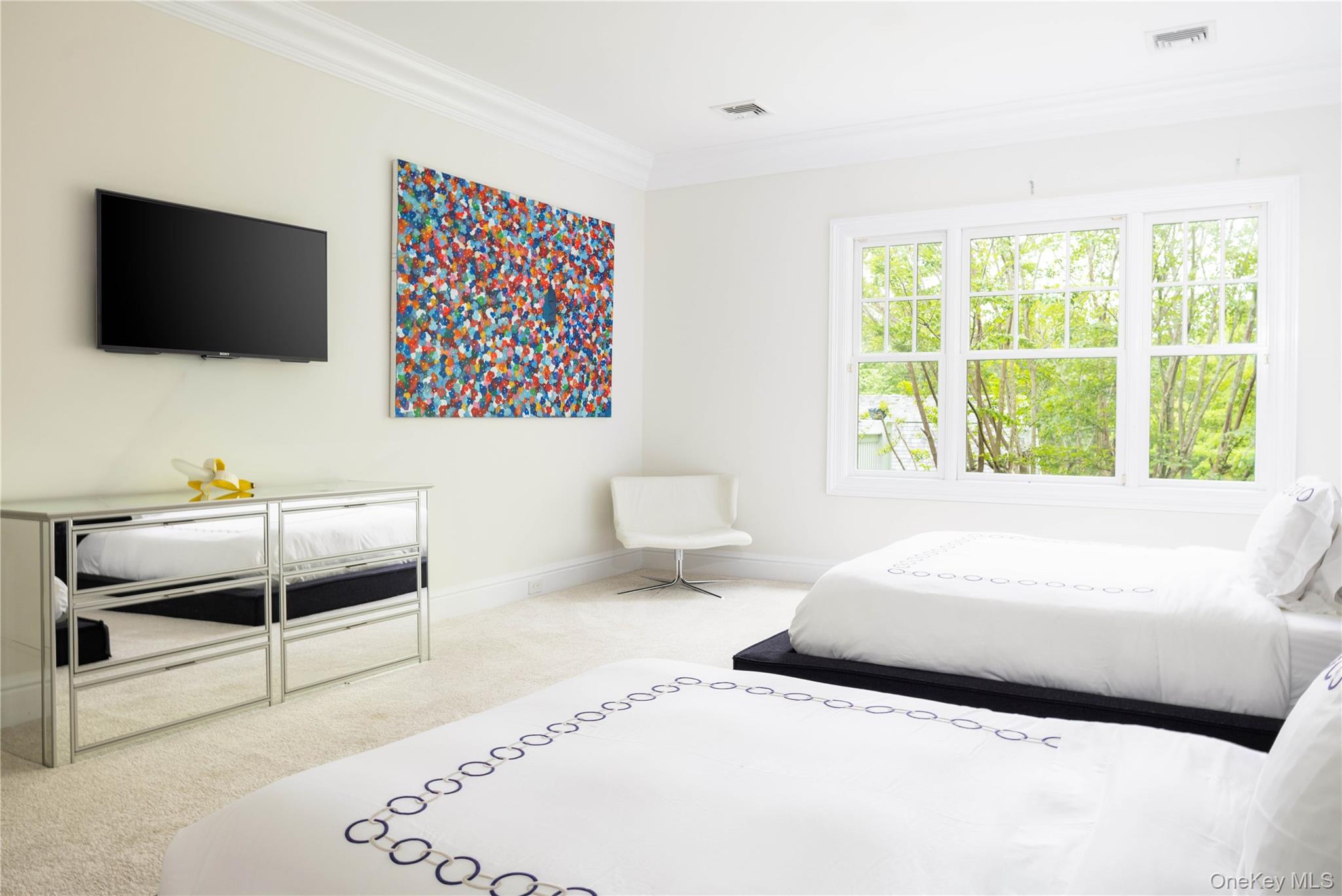 486 Middle Line Highway Bridgehampton, NY 11976 - Photo 15 of 25 a bedroom with a bed and a flat screen tv