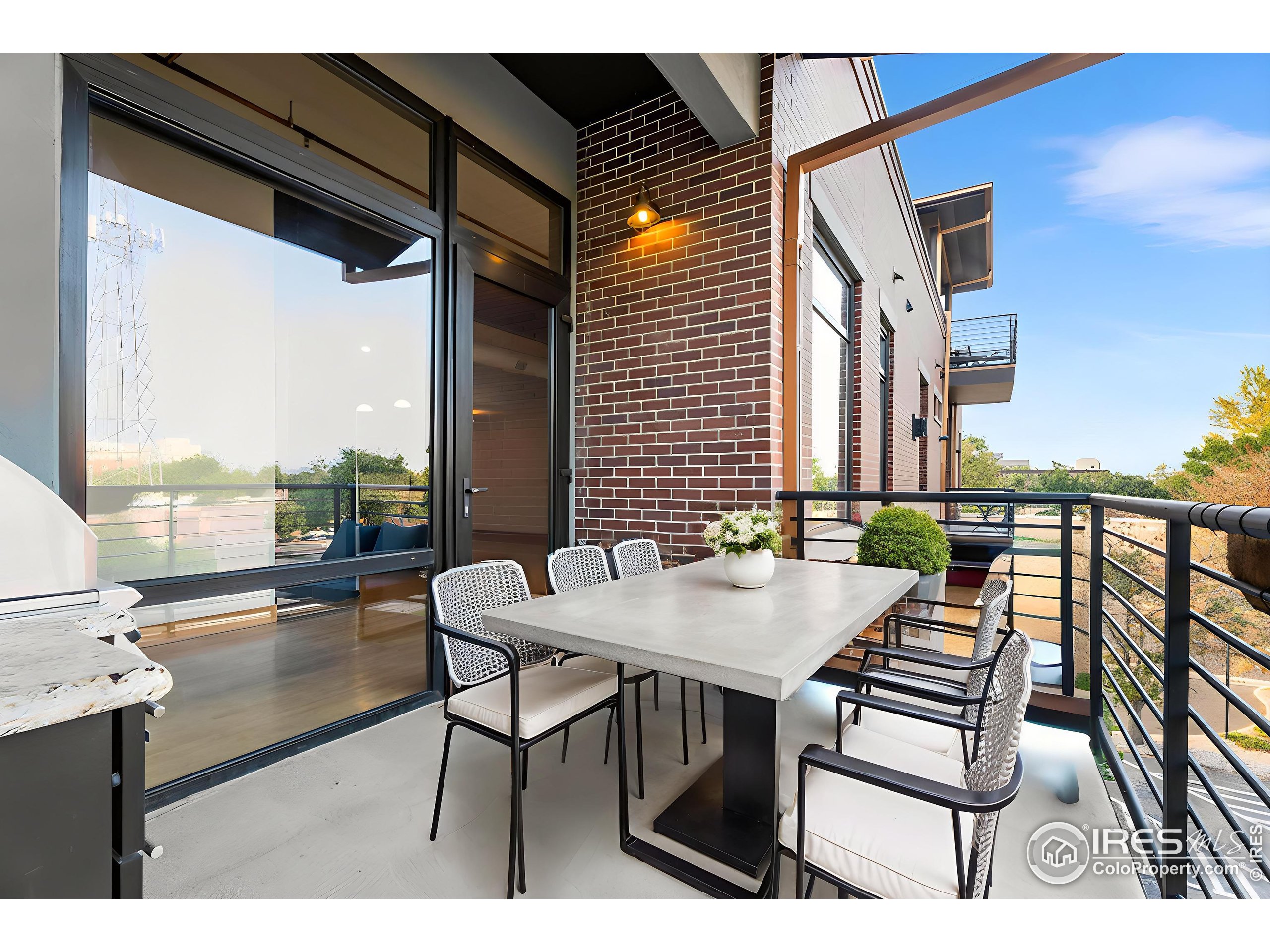 210 West Magnolia Street, Unit 320 Fort Collins, CO 80521 - Photo 24 of 45 a outdoor dining space with furniture and outdoor view