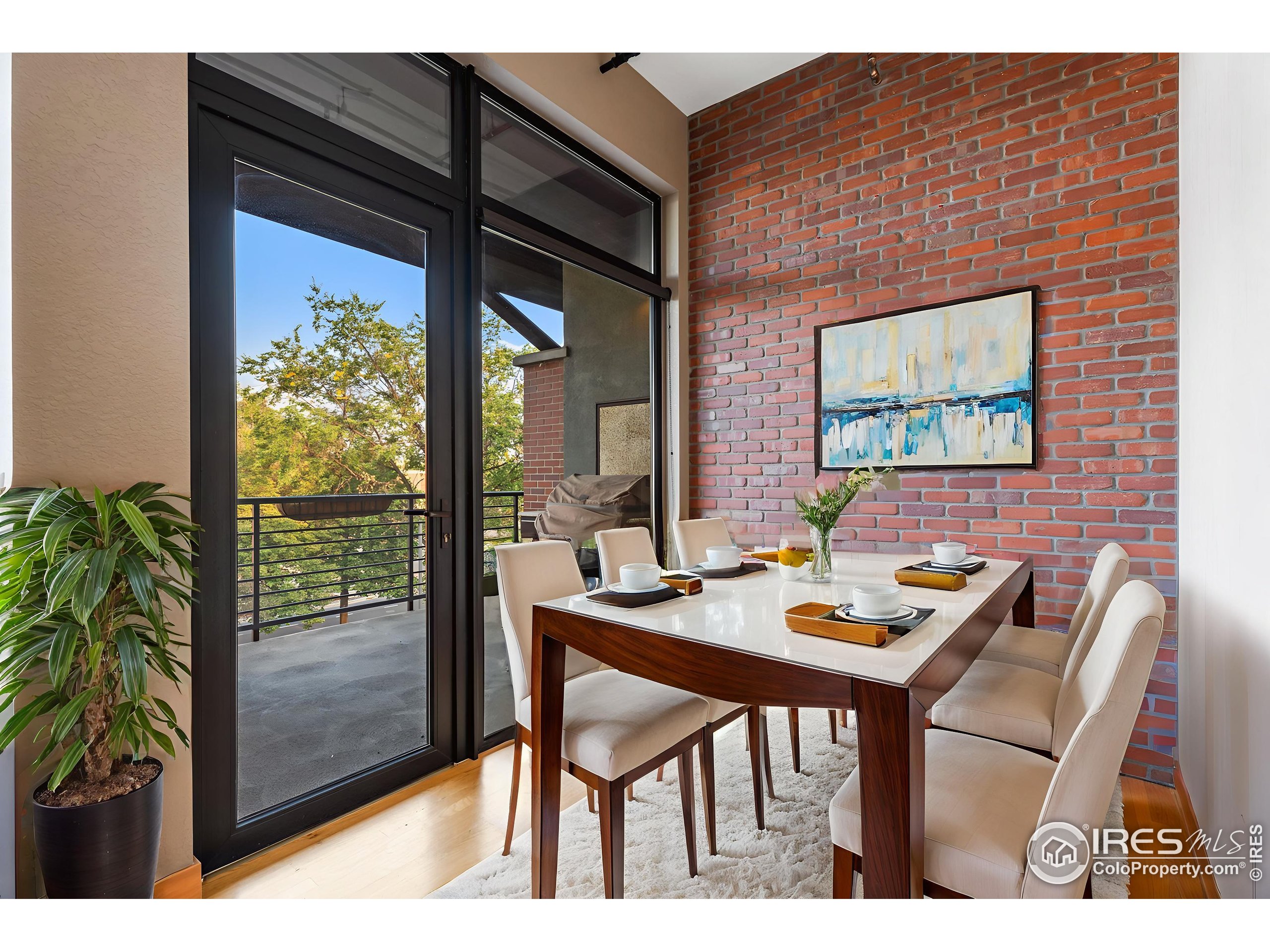 210 West Magnolia Street, Unit 320 Fort Collins, CO 80521 - Photo 32 of 45 a view of a dining room with furniture window and outside view