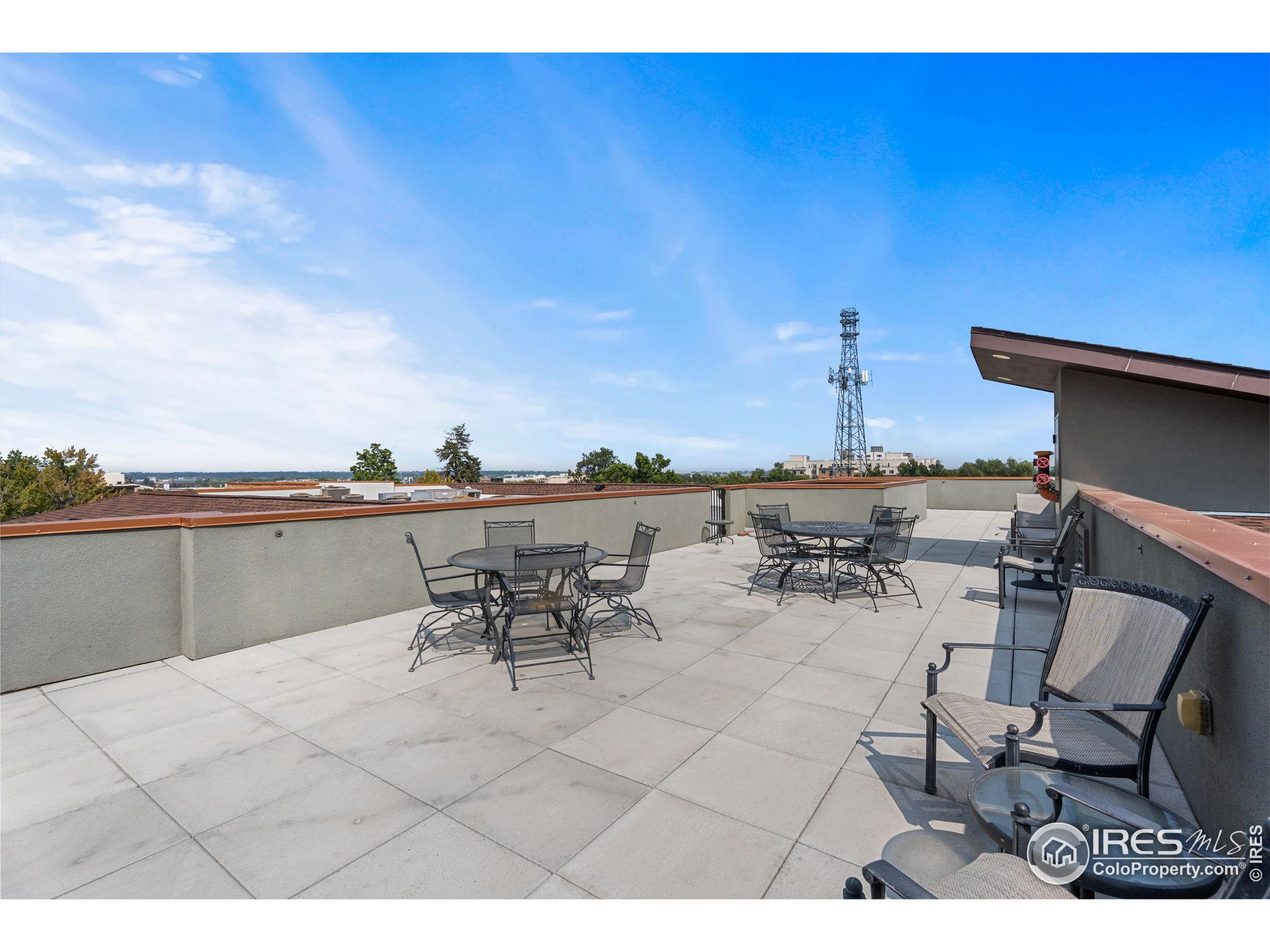 210 West Magnolia Street, Unit 320 Fort Collins, CO 80521 - Photo 41 of 45 a view of a terrace with furniture and stove