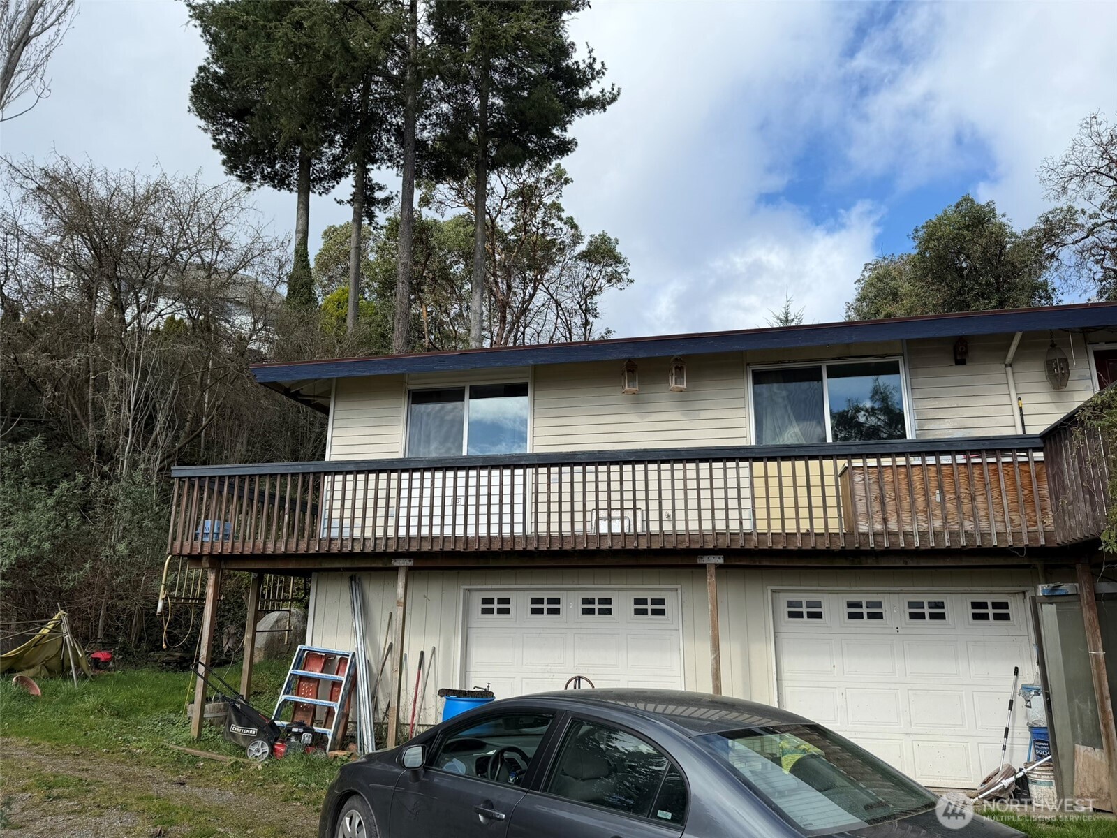 4725 Southwest 244th Street Vashon, WA 98070 - Photo 2 of 4 a view of a car parked on the roof deck