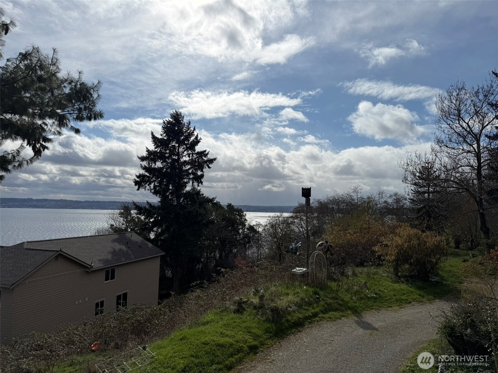 4725 Southwest 244th Street Vashon, WA 98070 - Photo 4 of 4 a view of a city street with a house in the background