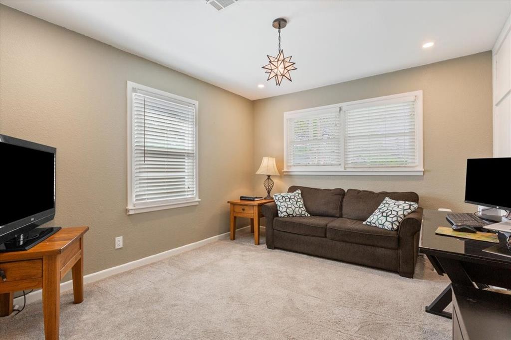 2209 North 52nd Street Waco, TX 76710 - Photo 23 of 34 a living room with furniture and a flat screen tv