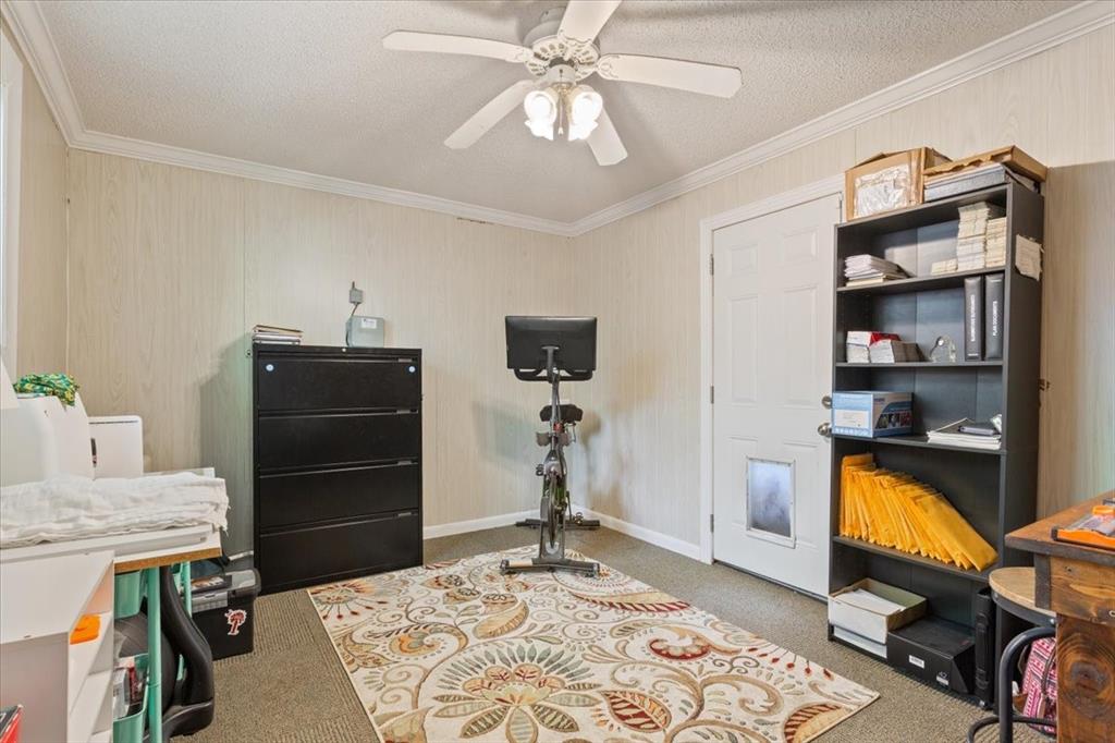 2209 North 52nd Street Waco, TX 76710 - Photo 24 of 34 a bedroom with a bed and a chandelier