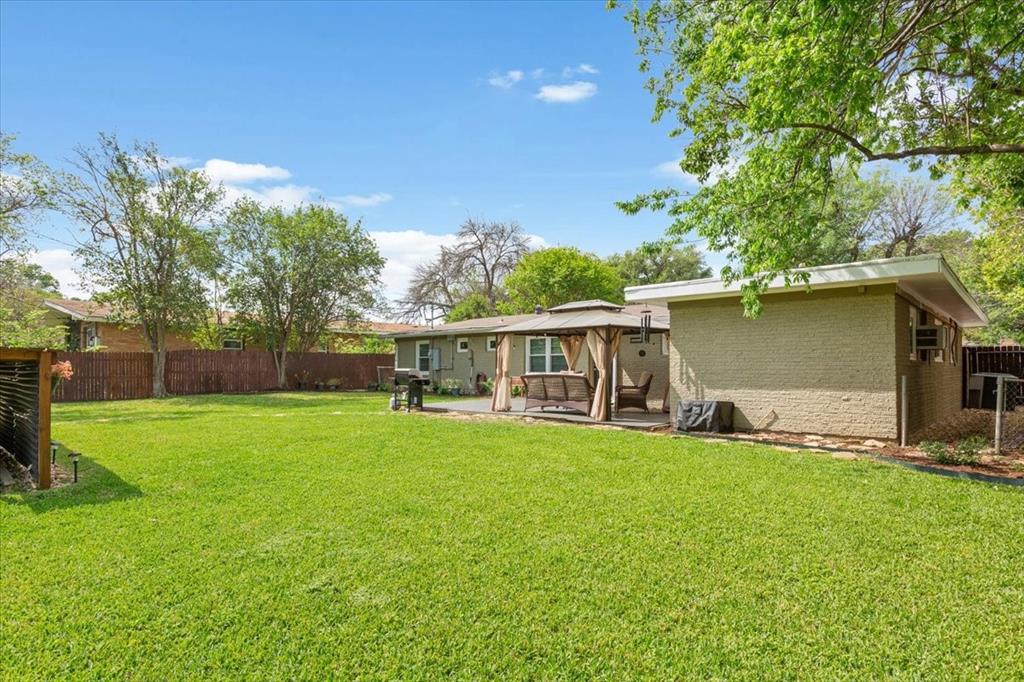 2209 North 52nd Street Waco, TX 76710 - Photo 31 of 34 a view of a house with a yard and sitting area