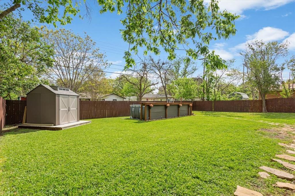 2209 North 52nd Street Waco, TX 76710 - Photo 32 of 34 a view of a yard with a house in the background