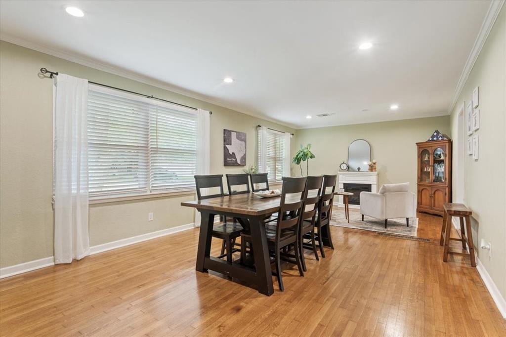 2209 North 52nd Street Waco, TX 76710 - Photo 8 of 34 a view of a dining room with furniture and wooden floor