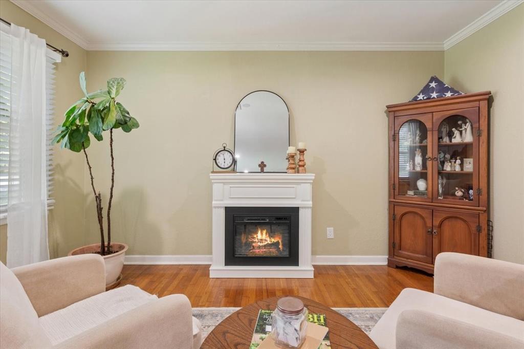 2209 North 52nd Street Waco, TX 76710 - Photo 10 of 34 a living room with furniture and a fireplace