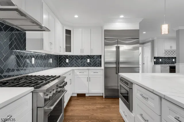 a kitchen with a refrigerator and a sink