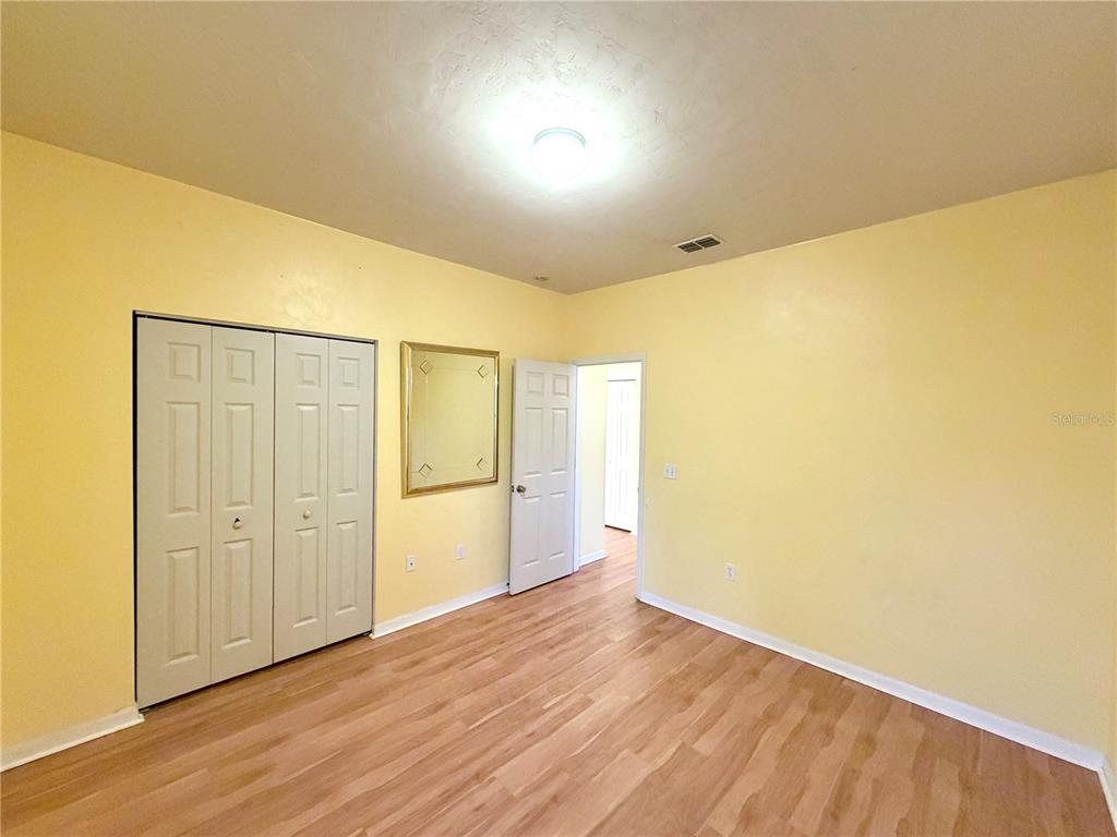 4423 Northwest 36th Street Gainesville, FL 32605 - Photo 21 of 43 a view of empty room with wooden floor