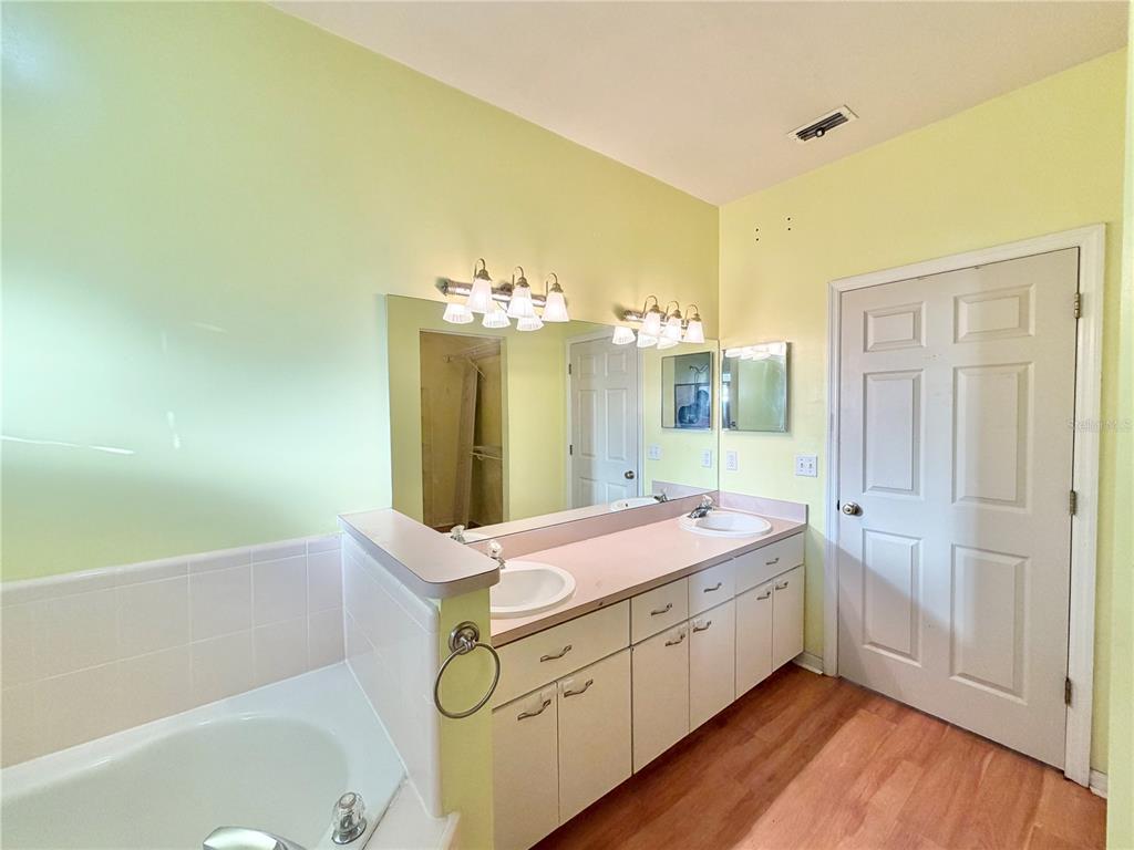4423 Northwest 36th Street Gainesville, FL 32605 - Photo 25 of 43 a bathroom with a sink and a mirror