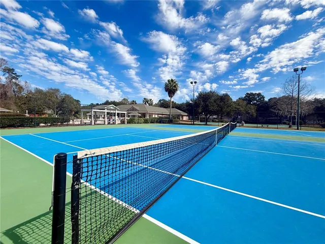 a view of an outdoor space and tennis court