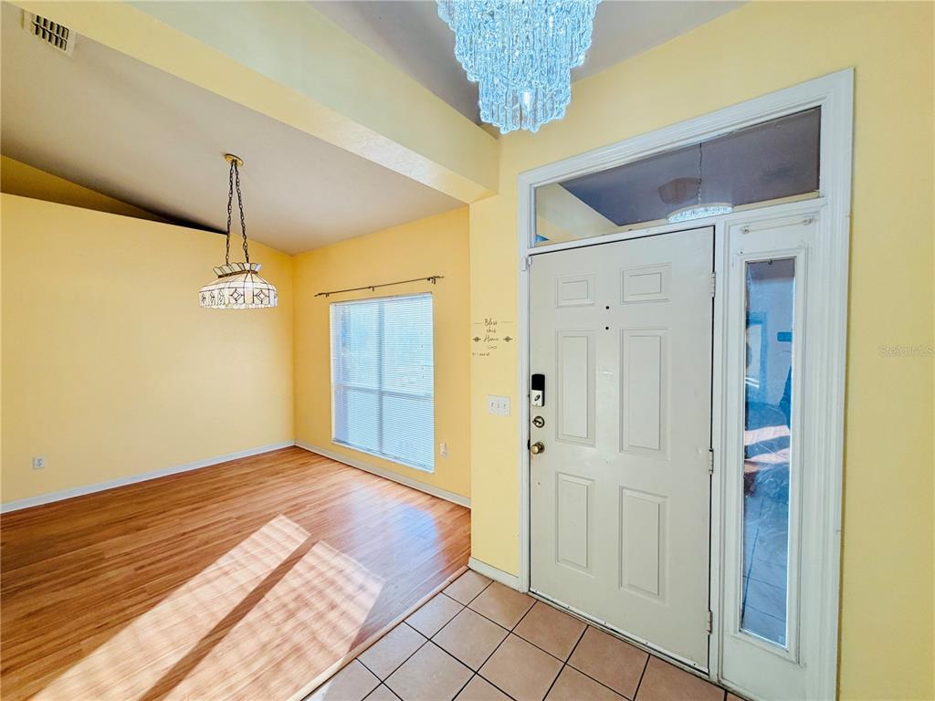 4423 Northwest 36th Street Gainesville, FL 32605 - Photo 4 of 43 a view of a hallway with a chandelier