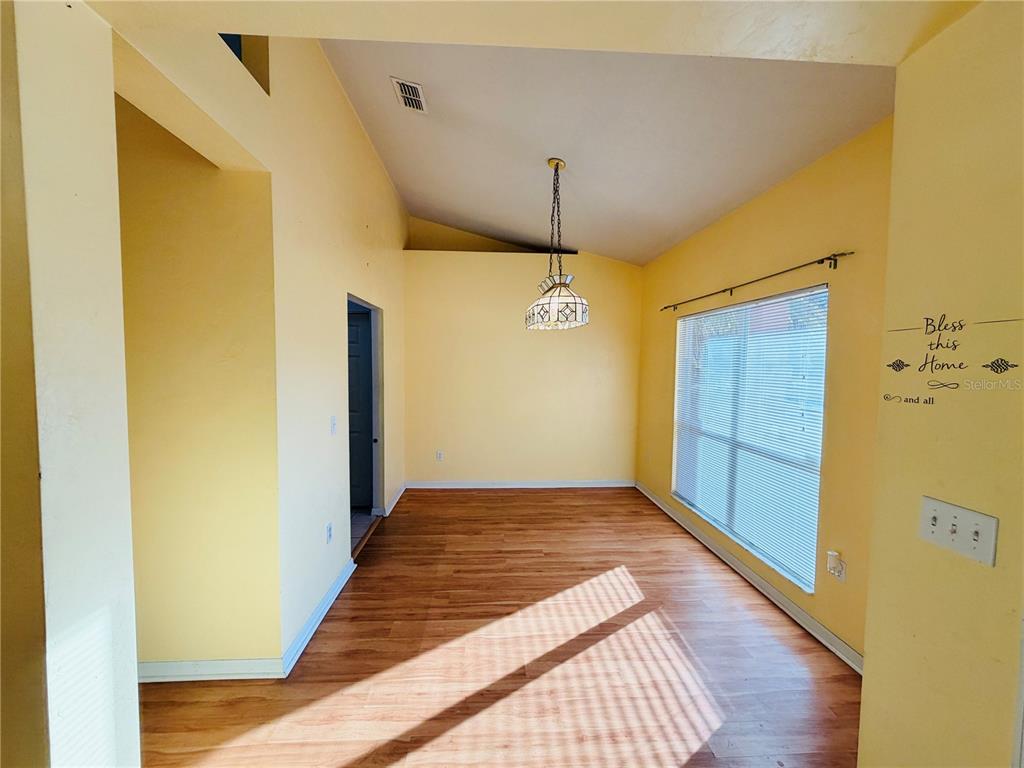 4423 Northwest 36th Street Gainesville, FL 32605 - Photo 5 of 43 a view of a hallway with wooden floor
