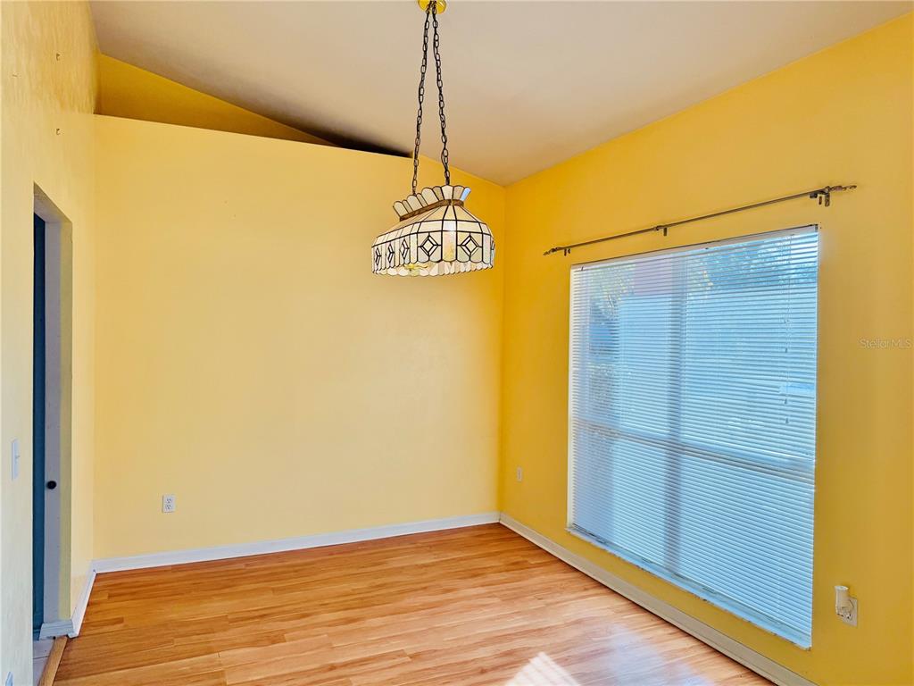 4423 Northwest 36th Street Gainesville, FL 32605 - Photo 6 of 43 a view of a hallway with wooden floor