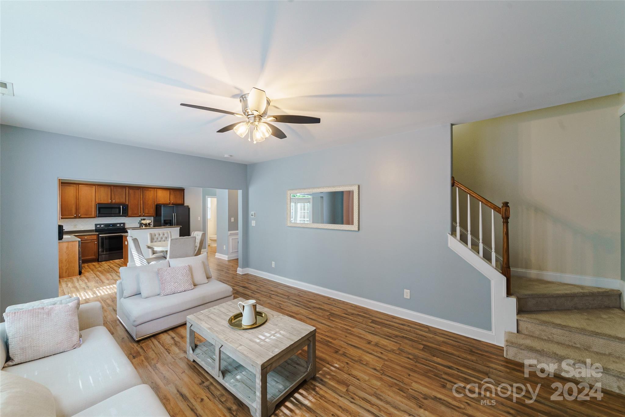 9917 Shellview Lane Charlotte, NC 28214 - Photo 15 of 35 a living room with furniture and a wooden floor