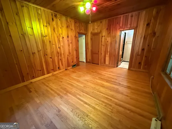 a bathroom with a sink mirror and toilet