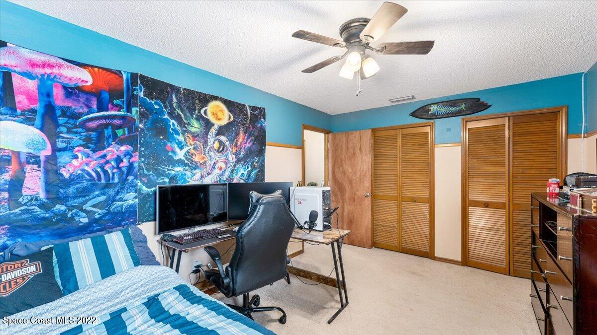 3655 Grant Line Road Mims, FL 32754 - Photo 29 of 47 a view of a livingroom with workspace and a window