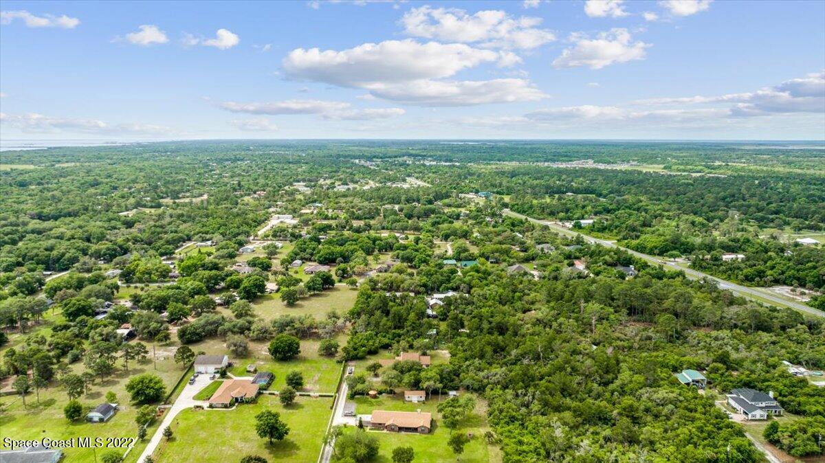 3655 Grant Line Road Mims, FL 32754 - Photo 40 of 47 a view of a big yard with lots of green space