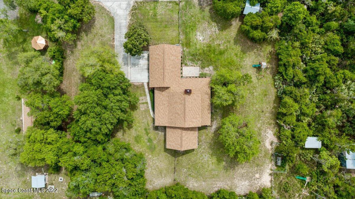 3655 Grant Line Road Mims, FL 32754 - Photo 42 of 47 an aerial view of residential house with outdoor space and trees all around