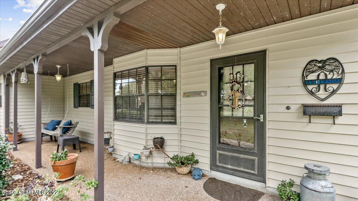 3655 Grant Line Road Mims, FL 32754 - Photo 5 of 47 a front view of a house with outdoor seating