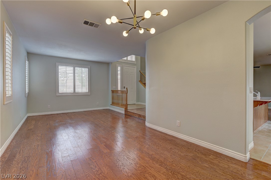 1813 Snow Spring Lane Las Vegas, NV 89134 - Photo 10 of 37 Hardwood floors and bright windows create an inviting atmosphere.